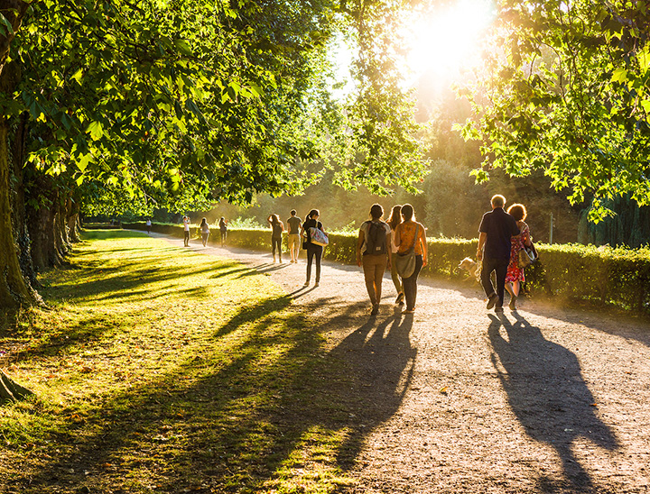 People walking along a public footpath in green open space